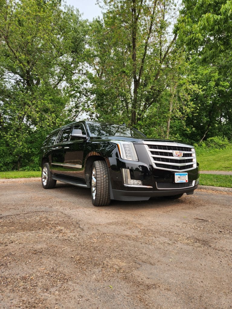 Executive Car Service Minneapolis. Front view of CMB Transport’s luxury black Cadillac Escalade, ideal for premium chauffeur services and executive transportation in Minneapolis and Twin Cities.