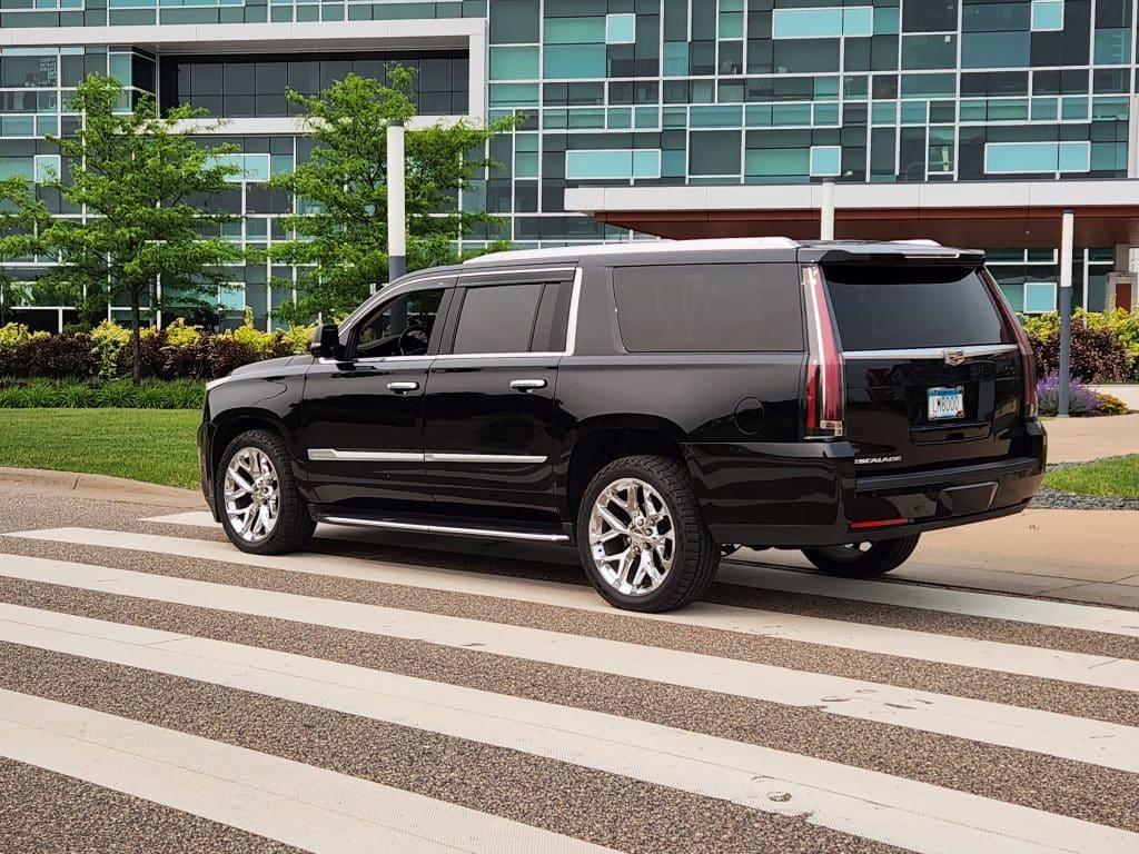 CMB Transport’s black Cadillac Escalade, offering professional executive car service for business clients, airport pickups, and upscale travel across the Twin Cities.